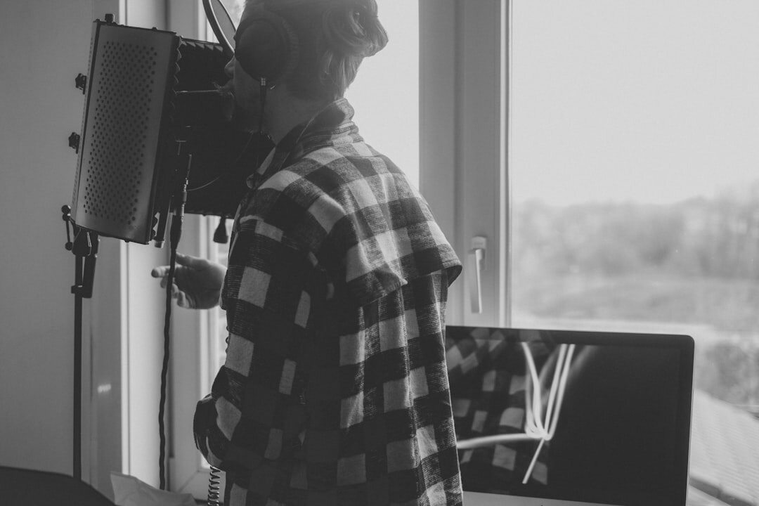 Portrait of a young Belgian woman video editor with headphones