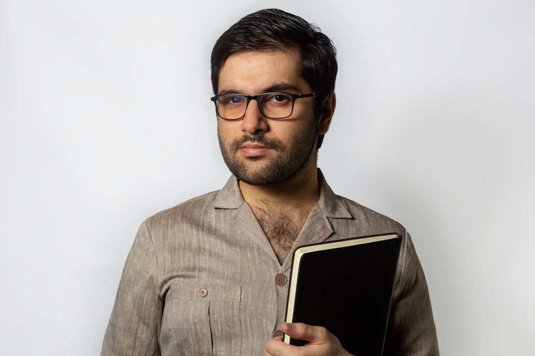 Portrait of a Belgian man entertainment journalist with a notebook